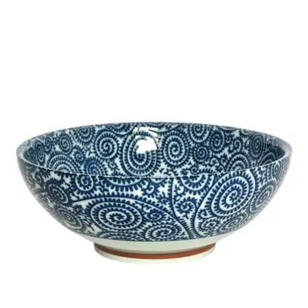Ceramic bowl with blue spiral pattern on a white background