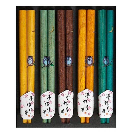 A set of five wooden chopsticks in
assorted colors, including yellow, green, brown, and teal