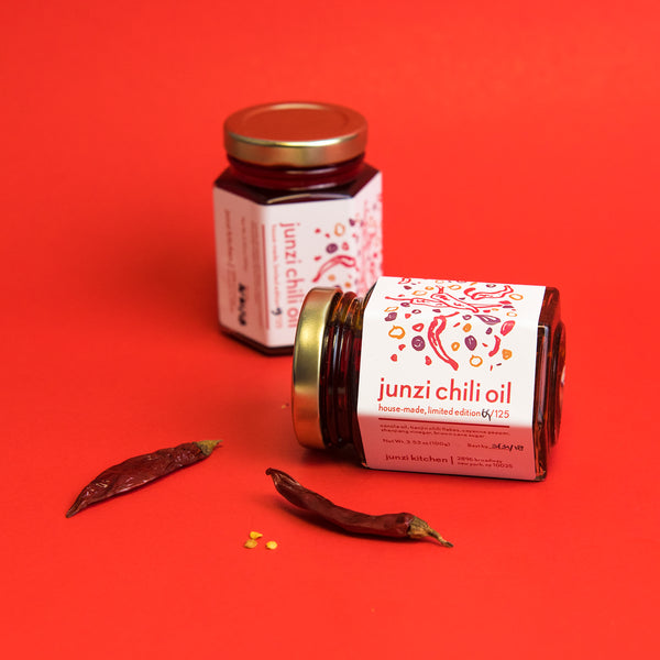 2 jars of Junzi Chili Oil with red chili peppers