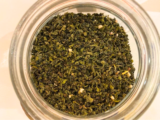 Peach Oolong Tea leaves in a jar