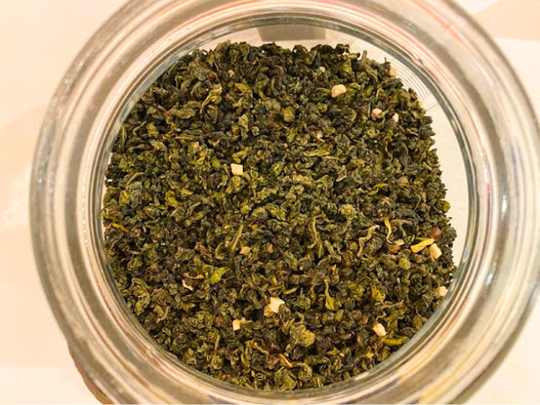 Peach Oolong Tea leaves in a jar