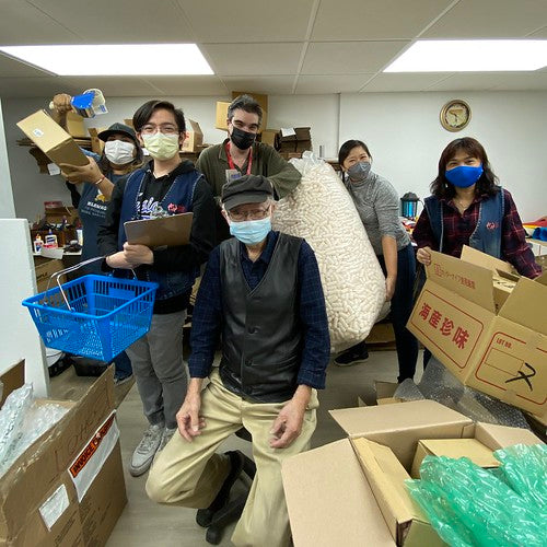 Mr. Chen and Pearl River employees in his "workshop"