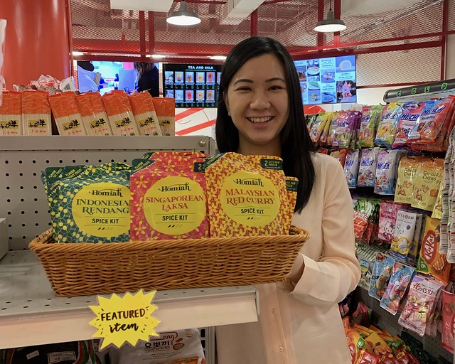 Homiah founder Michelle Tew behind display of her products at Pearl River Mart Foods 