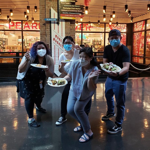 Pearl River Mart president Joanne Kwong with staff at Pearl River Mart in Chelsea Market with tacos