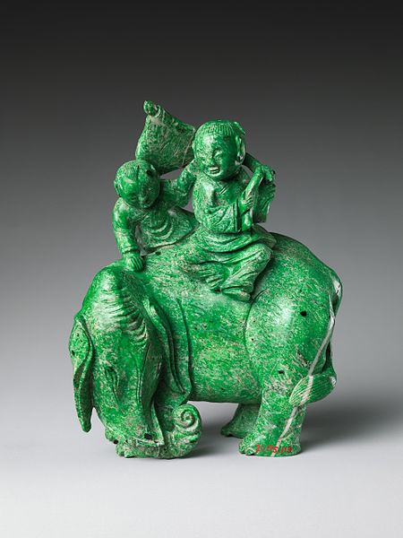 Jade figurine of an elephant with two riders