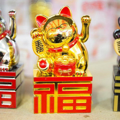 A shiny gold lucky cat