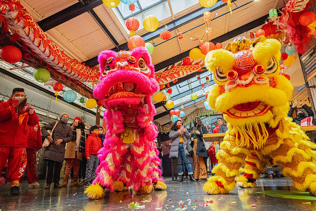 Two lion dancers at Chelsea Market