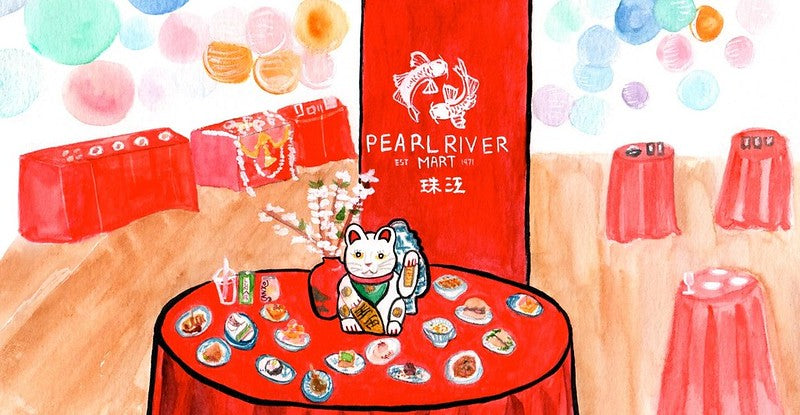 Watercolor painting of lucky cat on table surrounded by dishes and in front of a red Pearl River Mart banner with lanterns in the background