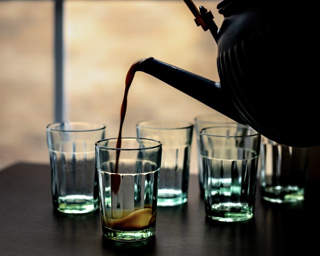 Glasses with masala chai and tea pot