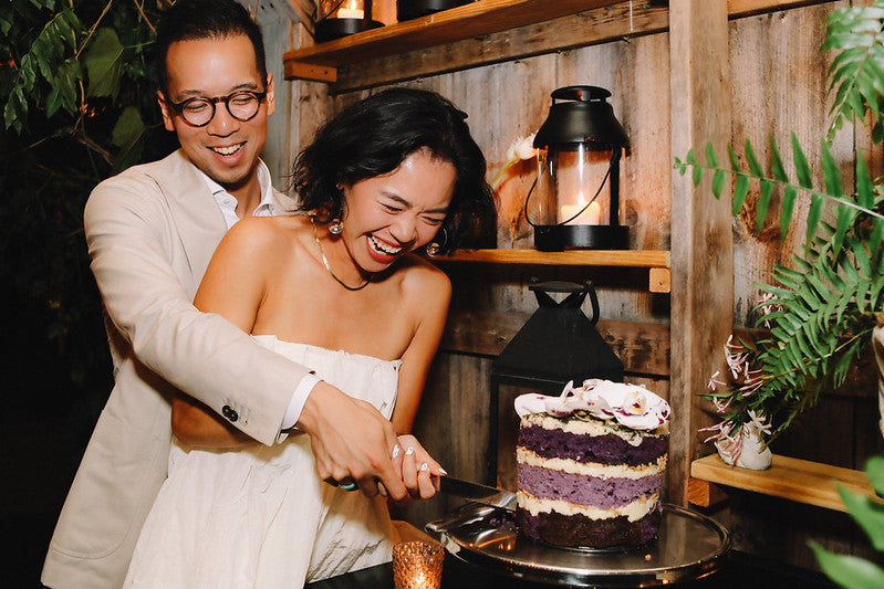 Groom Todd and bride Vicki cut their wedding cake