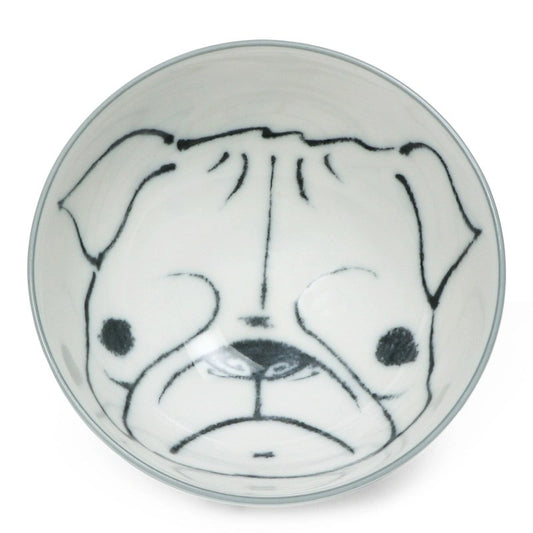 White ceramic bowl with a simple black line drawing of a pug's face at the bottom, creating a playful and charming impression.