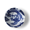 A round white ceramic bowl featuring a detailed blue dragon illustration, shown from a top-down perspective on a white background.