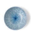 Blue ceramic plate with a radial pattern on a white background