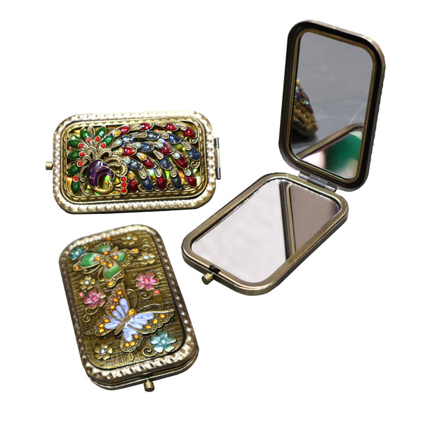 Three Jeweled compact mirrors, two closed one open