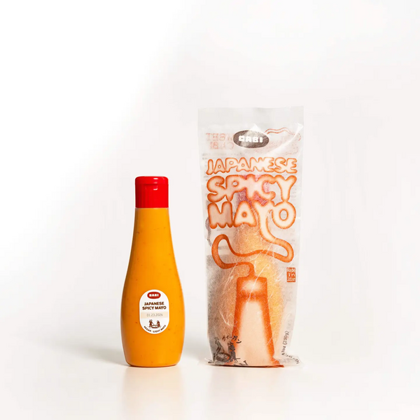 Orange bottle with red cap and clear packaging labeled 'Japanese Spicy Mato' on a white background