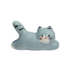 Ceramic cat-shaped object with gray, white, and black colors on a white background.