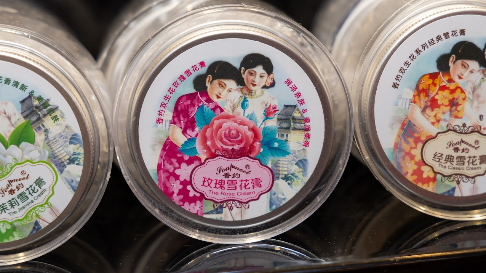 Close up of ladies in 1930s dress on cover of Shanghai beauty cream