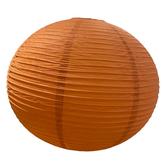 Round pumpkin color paper lantern on a white background