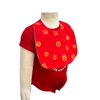 Red bib with yellow patterns on a mannequin against a white background