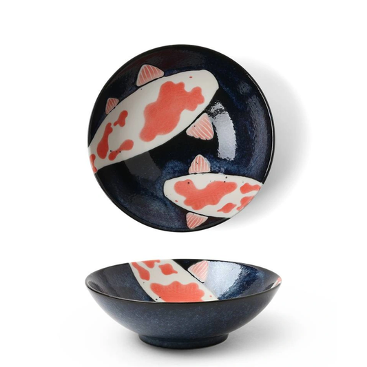 Ceramic bowl with koi fish design on a white background