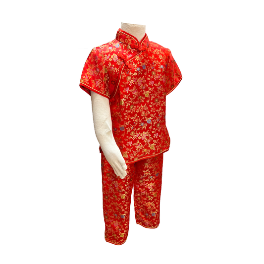 Traditional kids outfit in red with gold wild flowers on mannequin