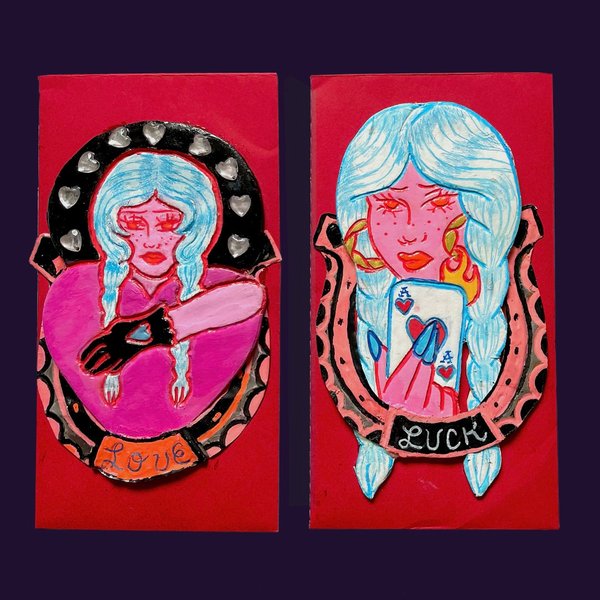 Two colorful illustrations of a woman with blue hair on red backgrounds, one labeled 'Love' and the other 'Luck'.