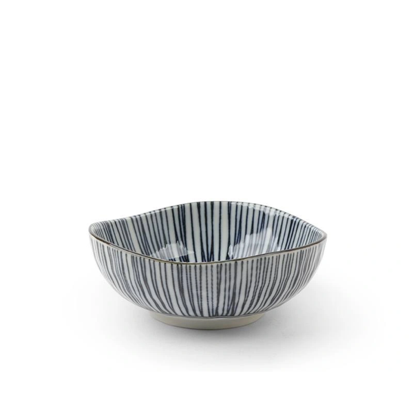 Ceramic bowl with black and white striped pattern on a white background