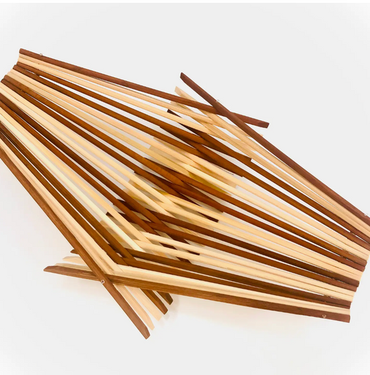 Folding bowl made with 20 pairs of upcycled chopsticks, striped pattern alternating natural and dark tea stained colors