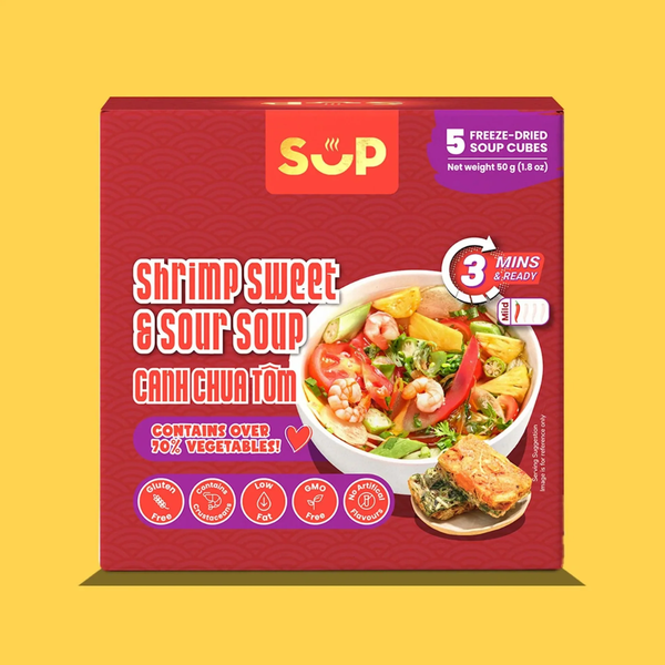 A red box of SUP Shrimp Sweet & Sour Soup (Canh Chua Tom) on a solid yellow background. The packaging features the yellow and red SUP logo, a photo of the prepared soup in a bowl, and various certification icons at the bottom.