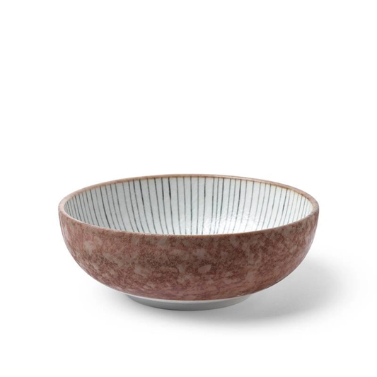 Brown ceramic bowl with a white interior on a white background