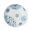White ceramic bowl with blue floral patterns on a white background