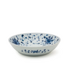 White ceramic bowl with blue floral patterns on a white background