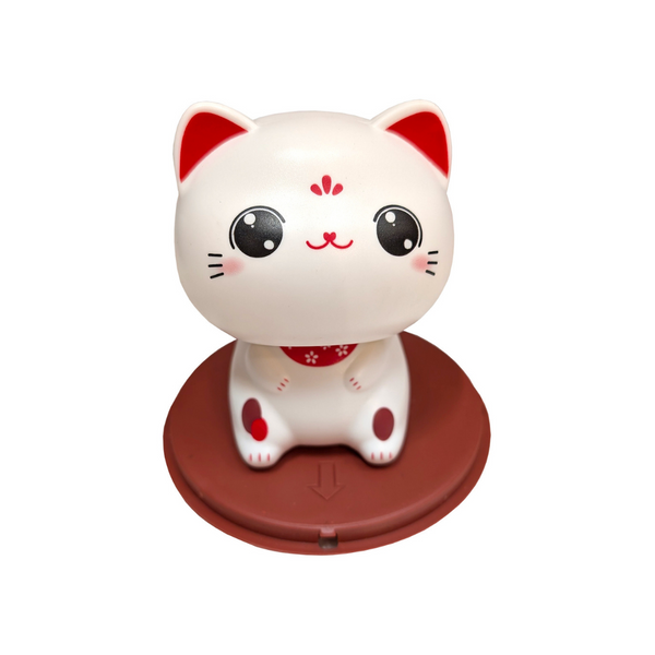 Cute lucky cat figurine on round brown stand 