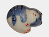 Ceramic cat figurine with blue and white pattern on a white background.