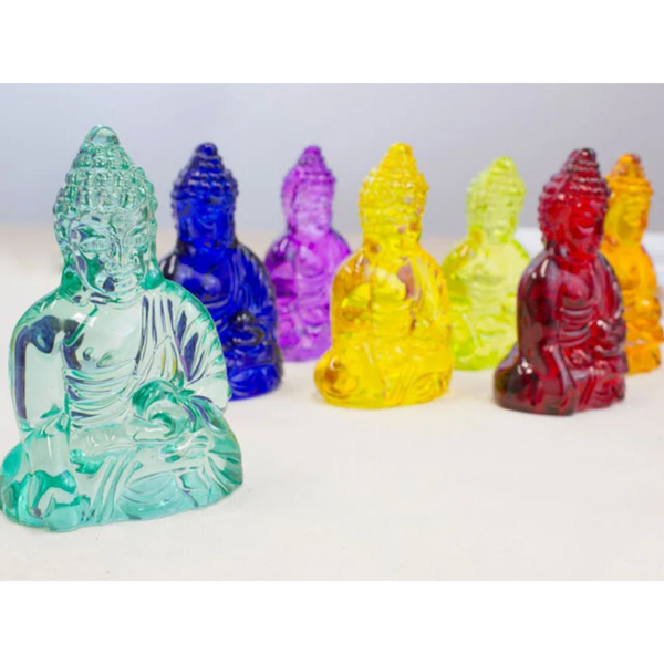 3.25" buddha crystal statues standing alongside one another. There is an orange, red, blue, purple, yellow, orange, light green, and teal