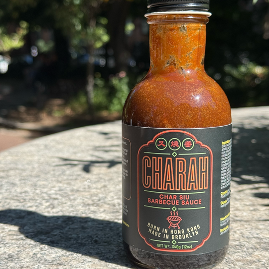 Jar of Charah BBQ sauce in outdoor setting