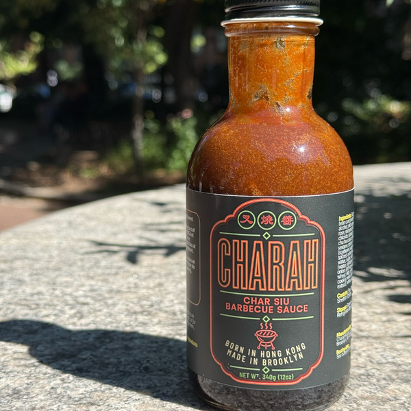 Jar of Charah BBQ sauce in outdoor setting