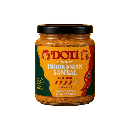 A jar of Doti Authentic Indonesian Sambal Original, featuring a black lid and a label with yellow, green, and red sections, set against a plain white background.