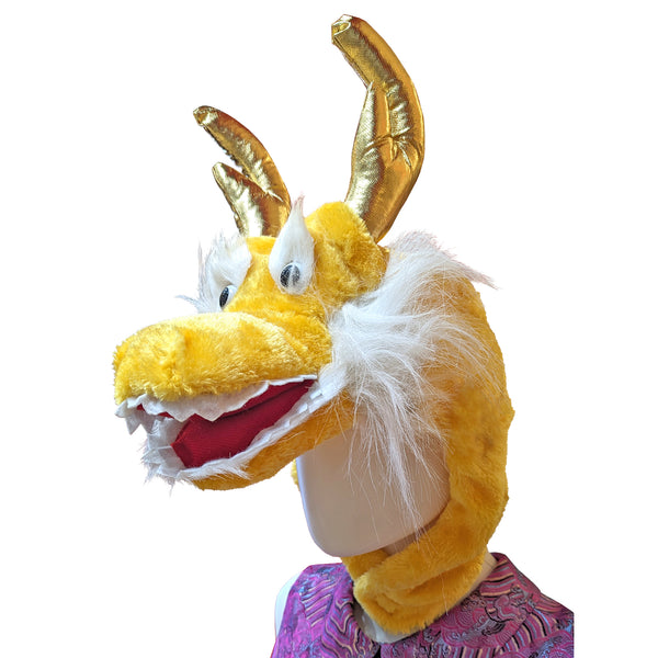 Yellow plush dragon hat on mannequin