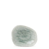 A small, rough, pale green sauce dish gemstone photographed on a plain white background.