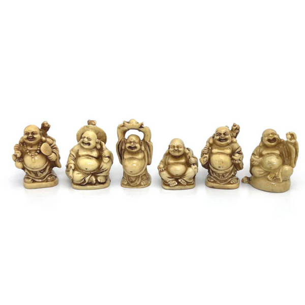 Six laughing buddha. Each in faux ivory and in a different pose