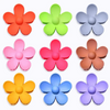 Set of colorful flower-shaped hair claws on a white background
