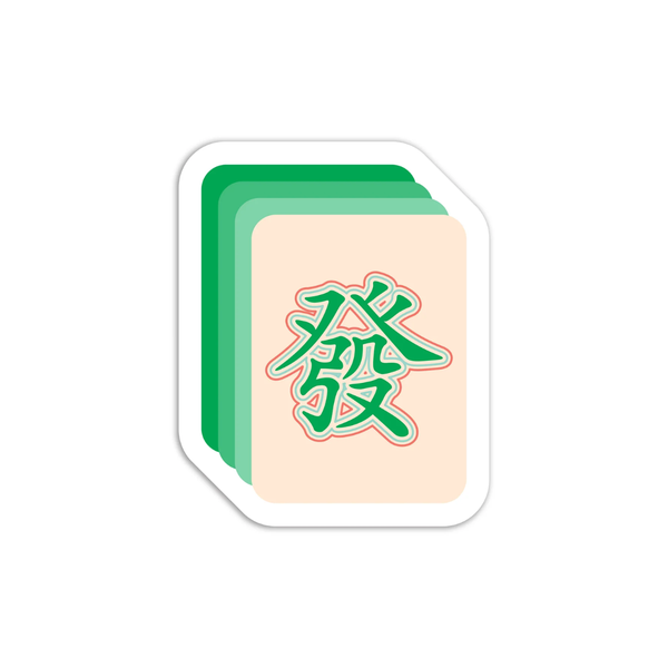 Mahjong tile with green characters on a beige background