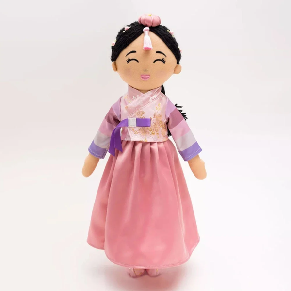 Doll in traditional Korean outfit on a white background