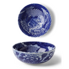 Blue and white ceramic bowl with dragon design on a white background