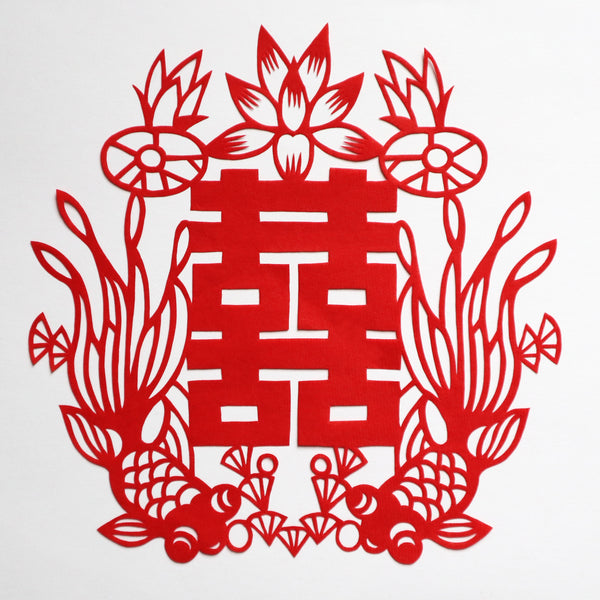 Red paper cut decoration with Chinese double happiness character and good luck fish