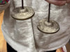 Someone chiming tingsha meditation cymbals