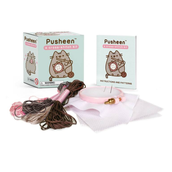 Pusheen cross-stitch kit with packaging and materials on a white background