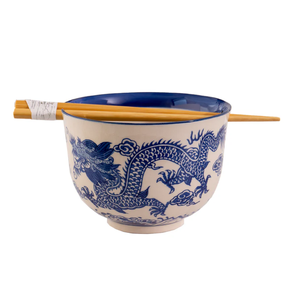 Ceramic bowl with blue dragon design and chopsticks on a white background
