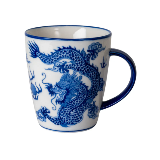 White mug with blue dragon design on a white background